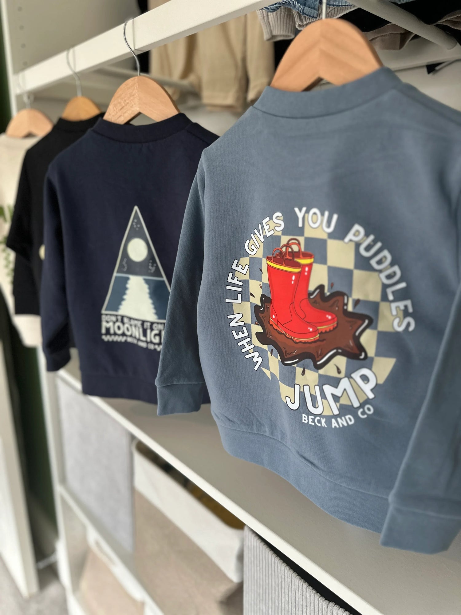 Beck and Co. kids' streetwear sweatshirts with skater-inspired graphic designs on hangers.