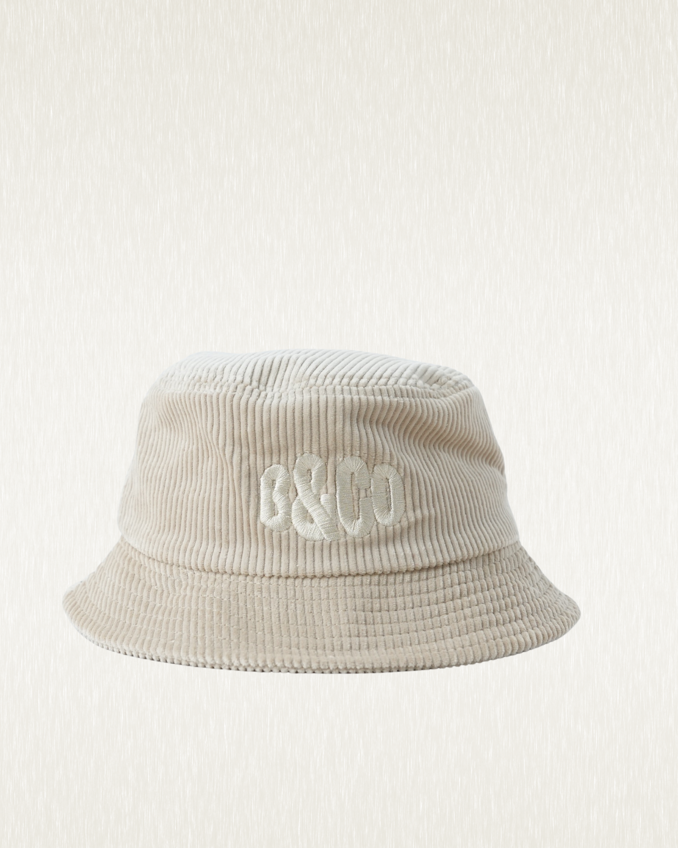 Beige bucket hat with 'B&CO.' logo on a light gray background