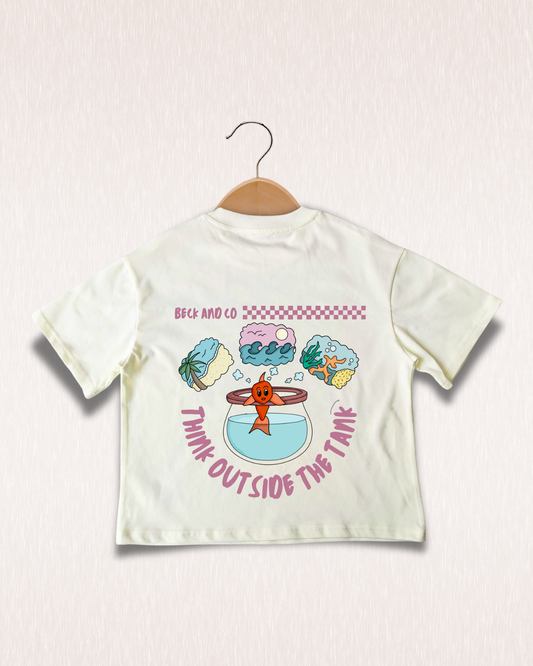 Children's t-shirt with cartoon design and text on a hanger against a light background