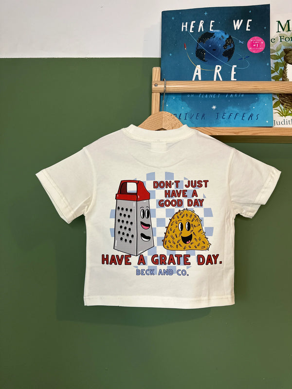 Beck and Co. kids streetwear tee with cartoon cheese and grater, playful skater design.