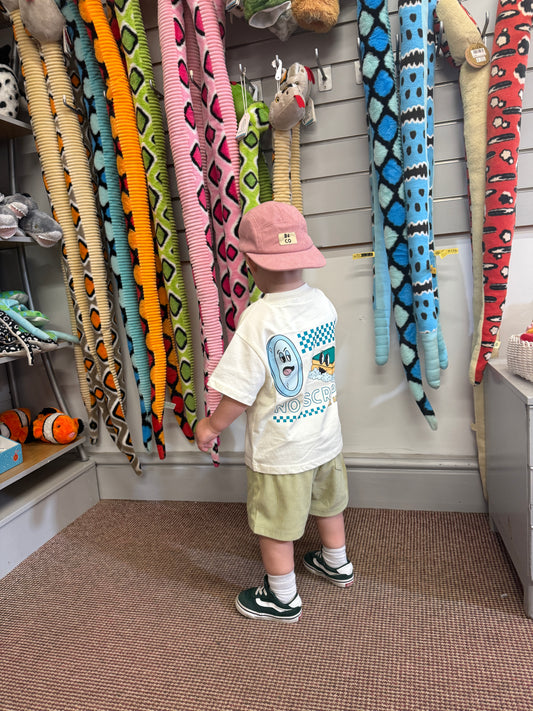 Child wearing skater cap backwards with corduroy skater shorts